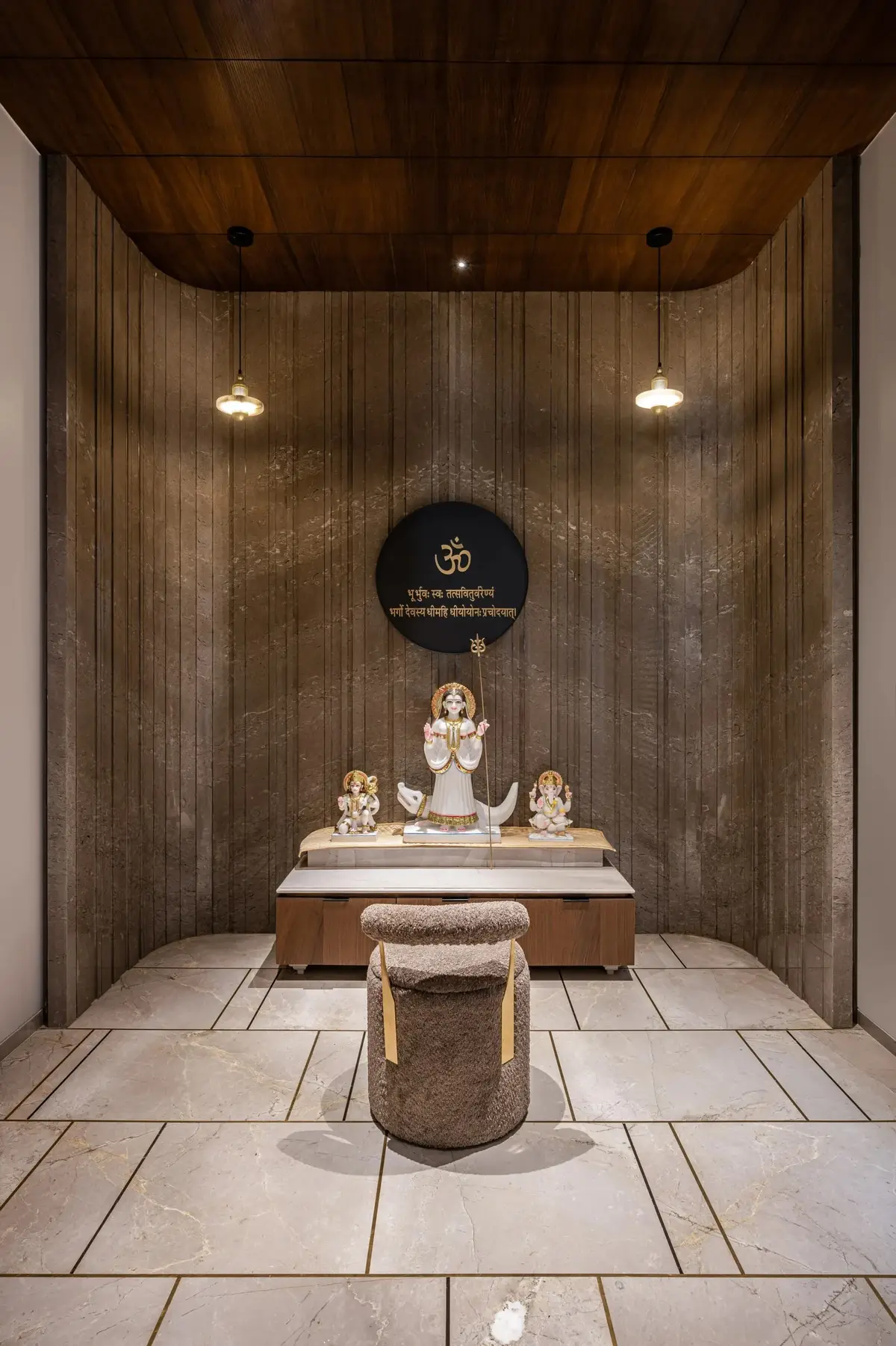 Prayer room with a timber ceiling, stone flooring and a central altar